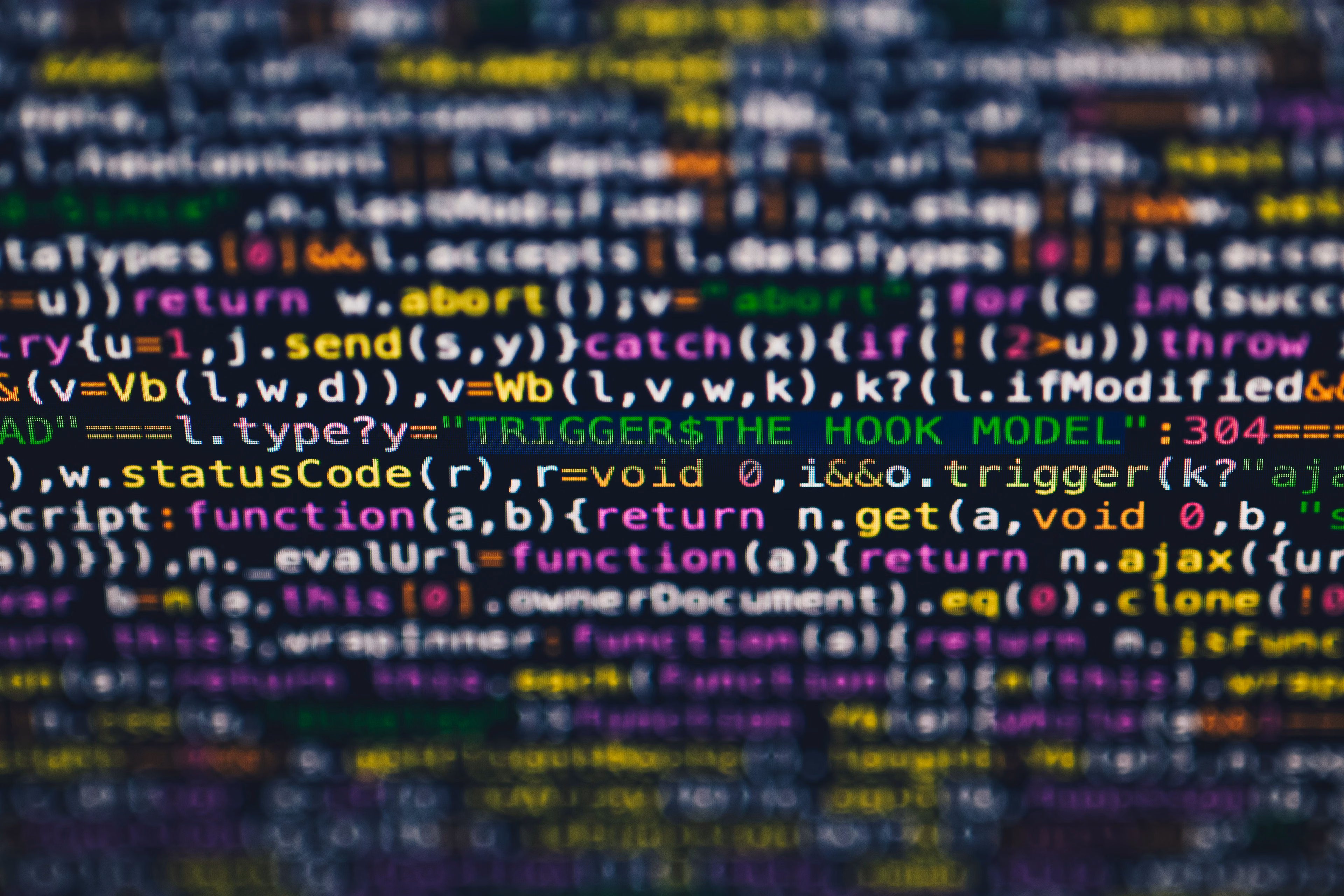 Close-up of colorful programming code lines displayed on a screen