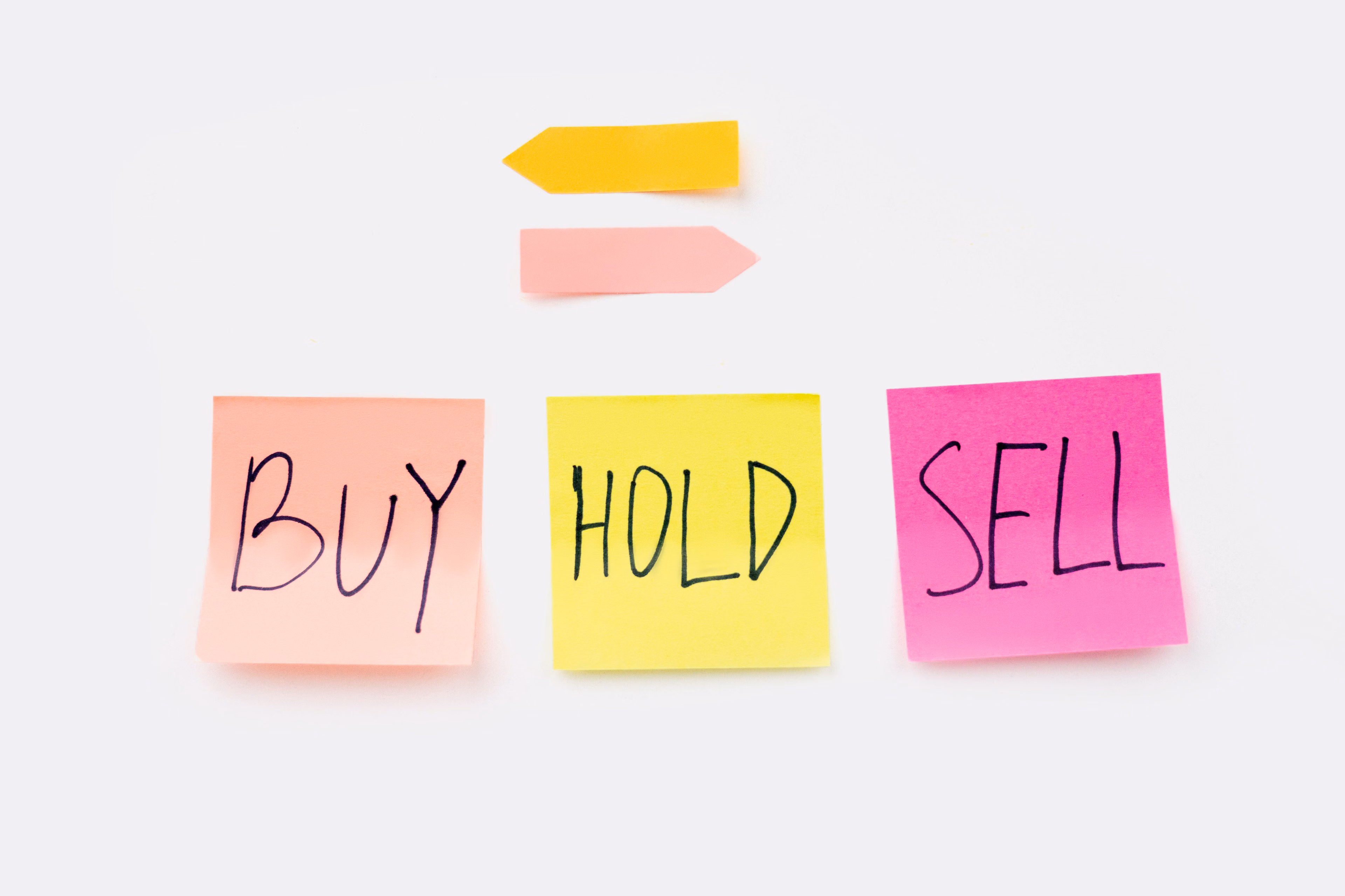 Financial documents and sticky notes spread across a business desk