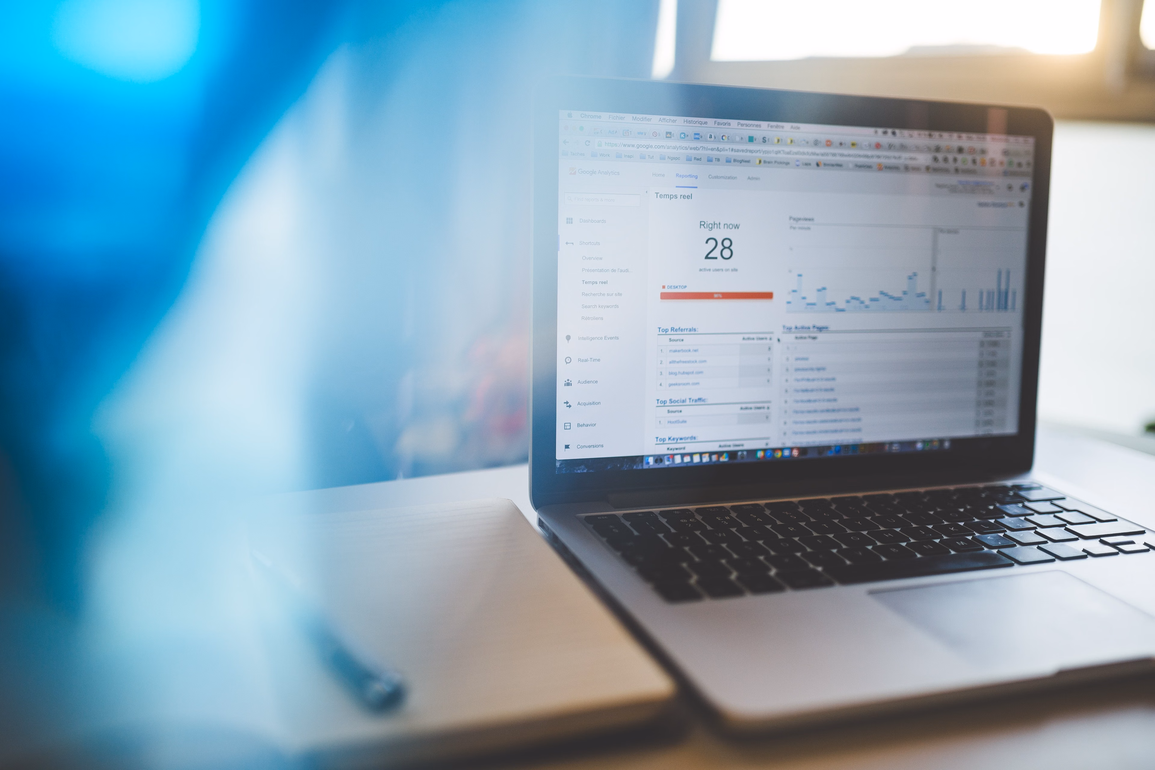 Laptop displaying an analytics dashboard in a modern workspace