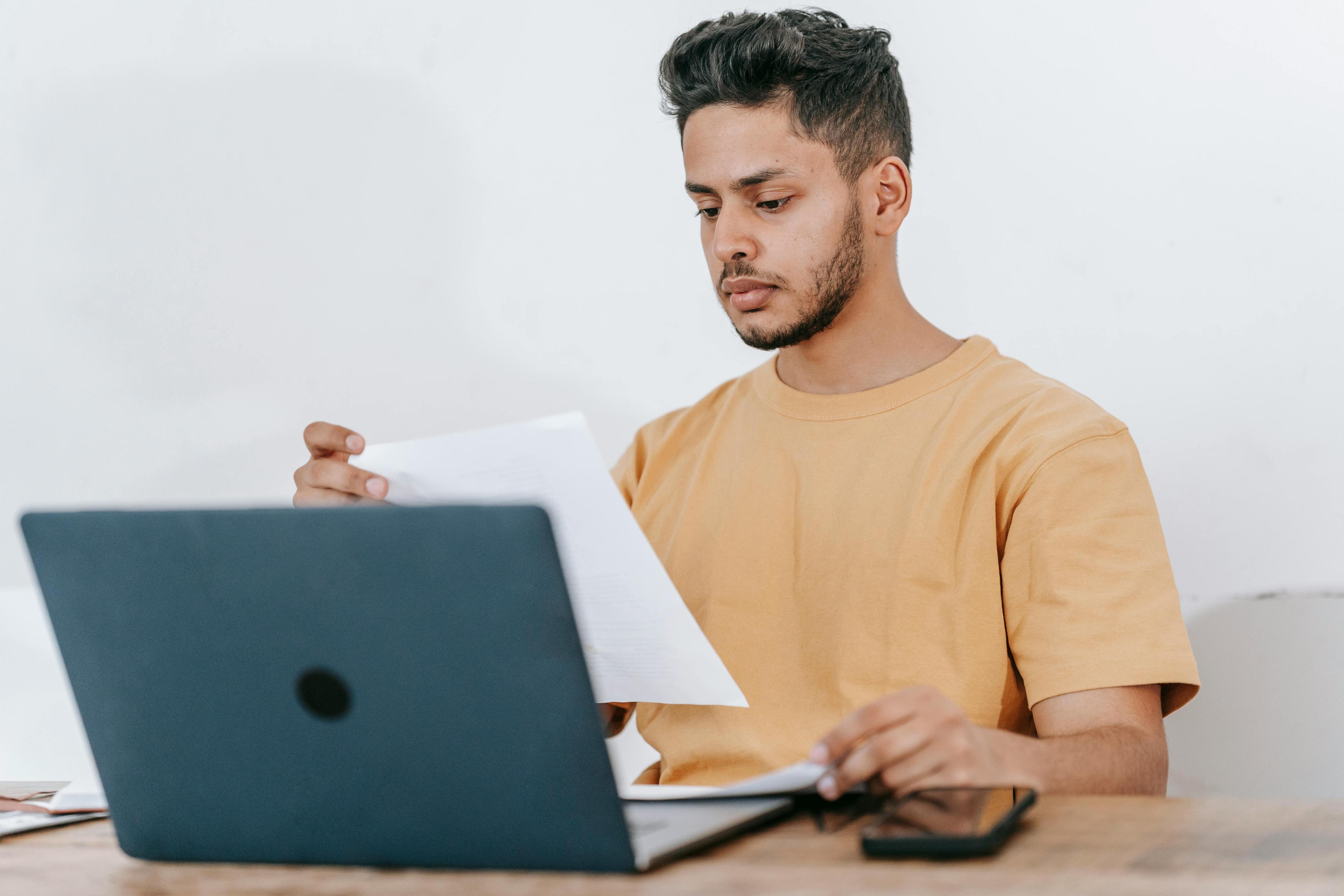 Freelancer reviewing contracts at a comfortable home workspace